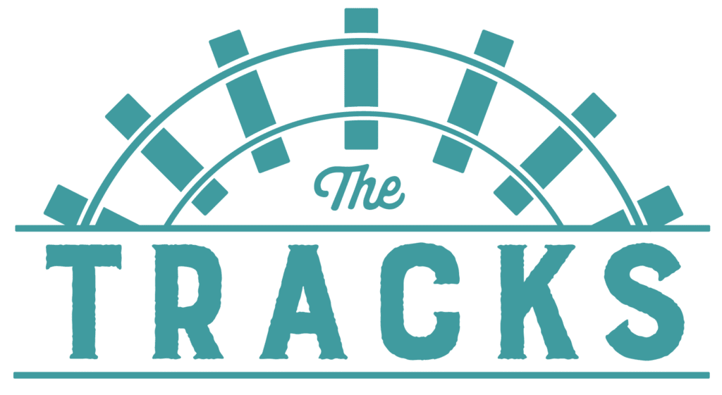 The Tracks logo blue